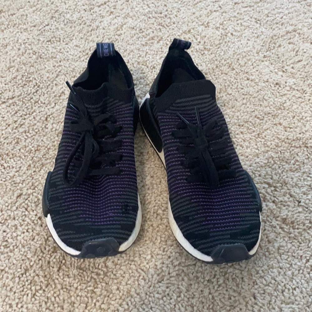 Purple and black Adidas NMD’s